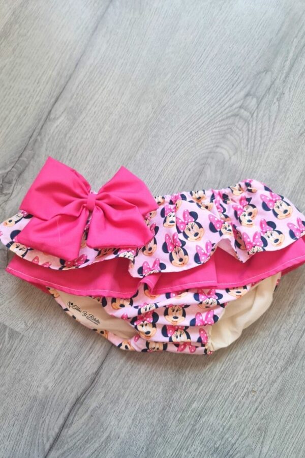 Cubrefalda con volante de Mickey y Minnie amorosos con lazo fucsia