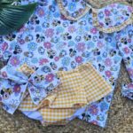 Conjunto de camisa y cubrepañal con volantes de pinaflor