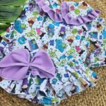 Conjunto de camisa y cubrepañal con volantes de Monstruos SA